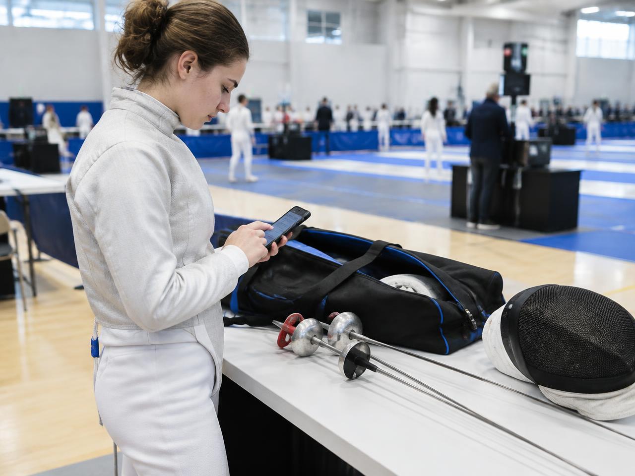 Fencer declaring equipment on a phone